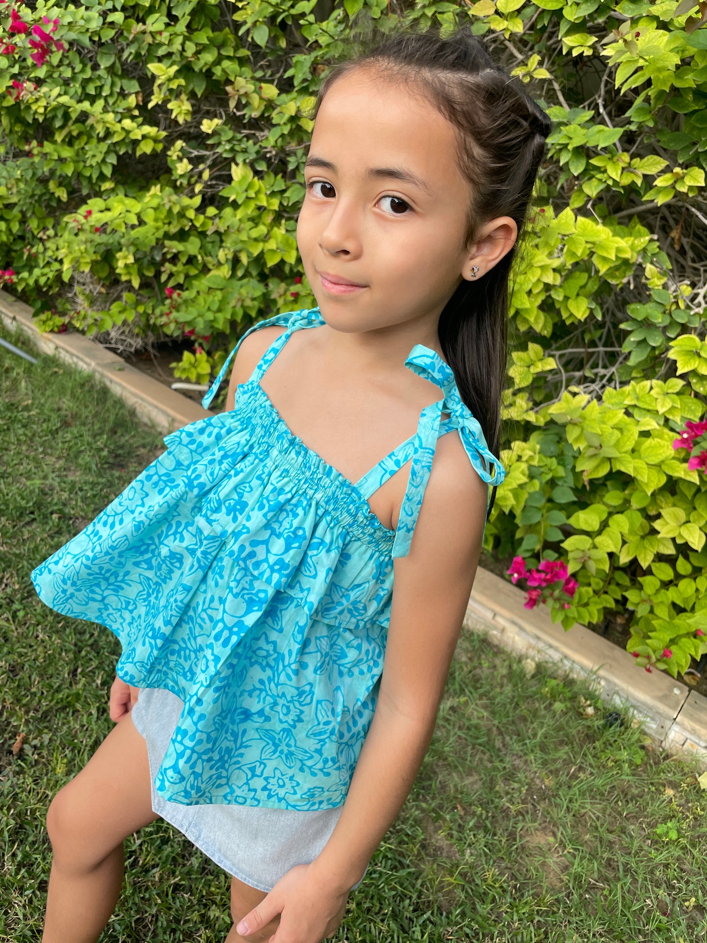 sustainable kids top in blue floral with shoulder ties made from batik handmade in Bali for girls in Dubai