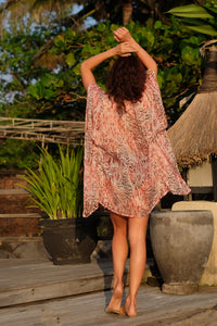 Back view of the Salila pink leopard print kaftan for women, made from silk chiffon, with rhinestone neckline trim, sustainable resort wear for women made in Bali for Dubai beach lovers & fashionistas