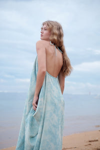 Versatile Seraphina Sky Blue Kaftan Dress shown as a chic halter with low back, neck ties, & luxurious chiffon fabric.
