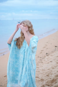 Flowing Seraphina Kaftan in sky blue marble chiffon, perfect for Dubai beachwear.
