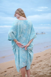 Back view of sky blue marble Seraphina beach kaftan dress for a breezy and stylish look in Dubai. Sustainable resort wear for women made in Bali