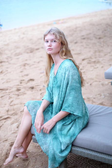 Textured green chiffon Seraphina kaftan dress styled as a classic kaftan, perfect for Dubai beaches and resort wear.
