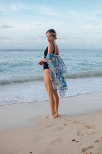 Suri women's kaftan in vibrant geometric crepe chiffon with bead trim, sustainable resort fashion in Dubai
