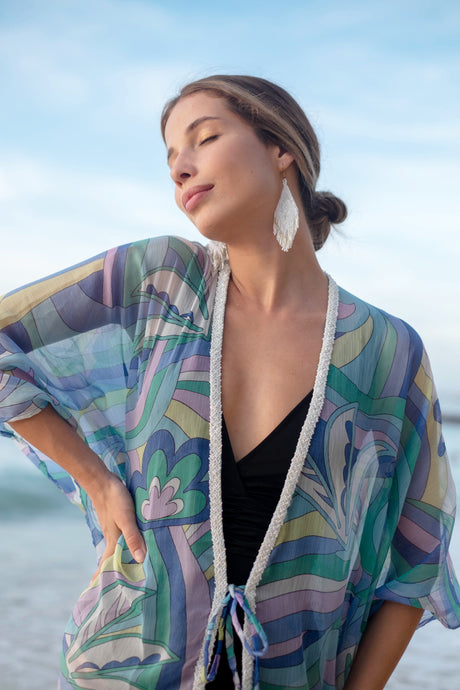 Pucci inspired geometric print women's beach kaftan in purple, blue, green & yellow, with hand-sewn beads along its neckline, for beach adventures in Dubai & beyond