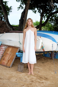 Lightweight chiffon Mimi midi beach dress with shimmering gold and silver foil specks, adjustable halter ties, and hand-sewn beadwork.