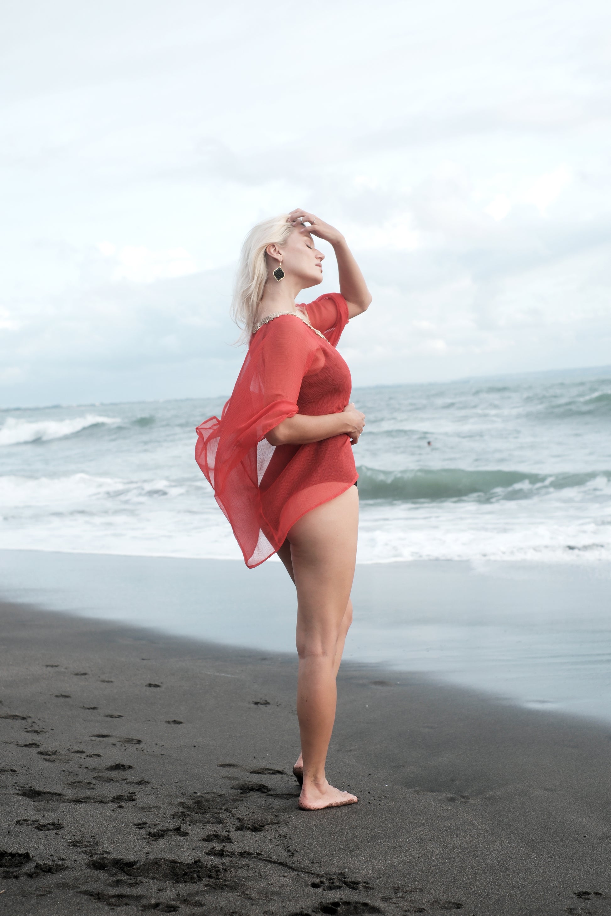 Flowy burnt orange beach kaftan cover-up with hand-sewn gold neckline trim for Dubai resort wear