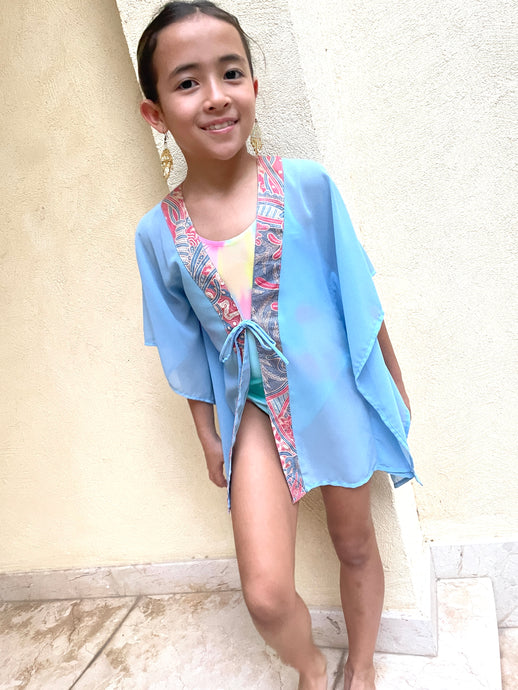 Cahya Powder blue kids beach kaftan with hand-stamped batik trim – perfect for Dubai beach days.
