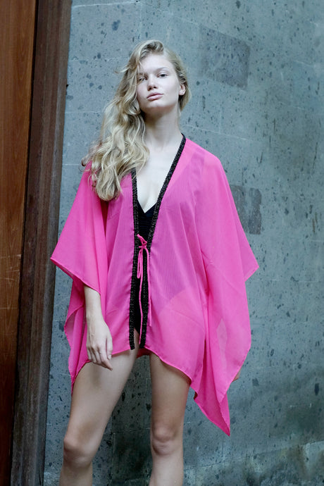 Luxury slow fashion beach kaftan in soft pink chiffon and hand sewn bead trim, sustainable resort wear made in Bali for women looking for best beach kaftans in Dubai
