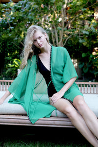 Glamorous beach kaftan in a gorgeous green crepe chiffon with hand sewn neckline beads, for women wanting best beach kaftans in Dubai