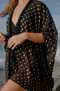 sustainable slow fashion beach kaftan for women in dubai in black and gold chiffon with handsewn beads along the neckline