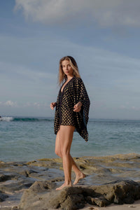 luxurious beach kaftan for women in Dubai made from black chiffon with gold motifs, for women looking for exclusive and unique beach cover ups in Dubai