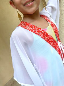 Sustainable kids beachwear: Onism orange floral kaftan with boho batik design, available for sale in Dubai
