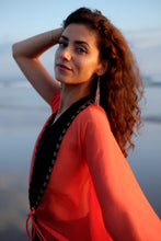 Load image into Gallery viewer, Luxurious modern and glamorous beach cover-up kaftan for women in Dubai, made from sunset orange crepe chiffon and hand-sewn neckline beads
