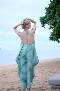 Boho chic textured green chiffon Seraphina kaftan dress styled as a halter, blending versatility with beach glamour. Sustainably made in Bali for women in Dubai