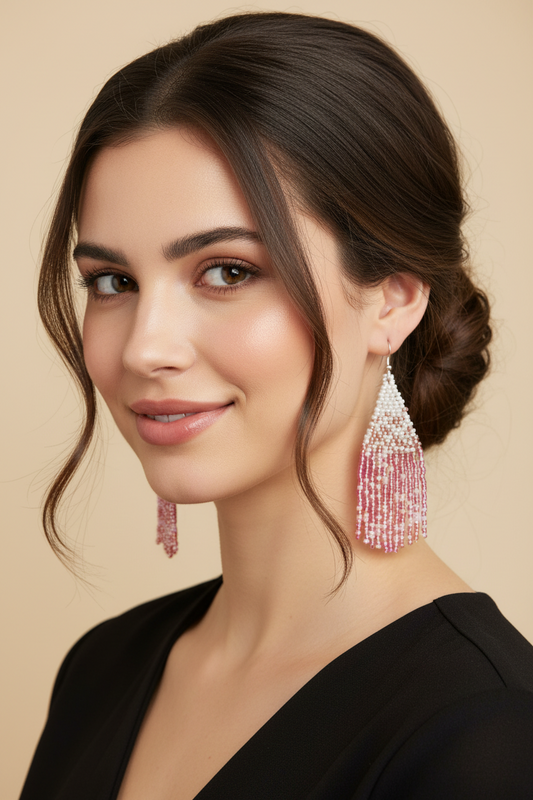 Woman wearing dangle pink and white handmade beaded earrings 