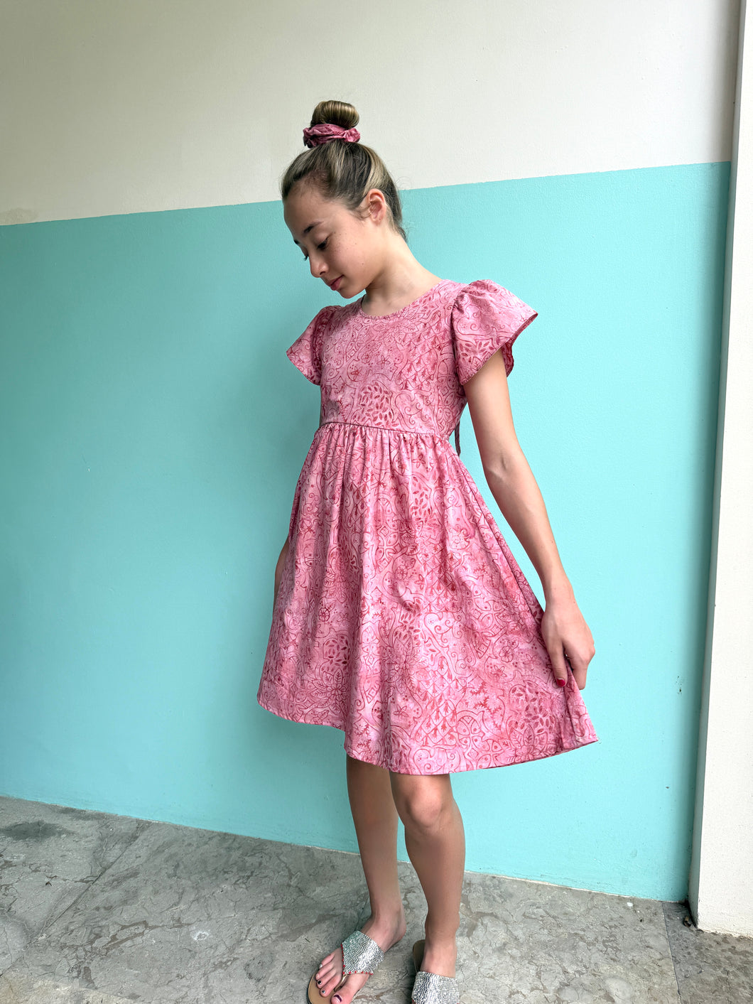 Sustainable Ivy girls' batik sundress in pink floral print, handmade kids' dress from Bali for sale in Dubai
