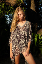 Load image into Gallery viewer, Zebra print silk kaftan for women, chic beach cover-up, sustainable resort wear made in Bali, shop in Dubai.
