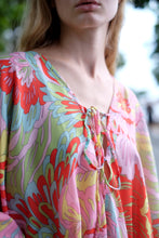 Load image into Gallery viewer, Close up of luxurious silky floral print Seraphina kaftan dress, can be styled as a traditional kaftan or halter dress, for bold fashion lovers in Dubai