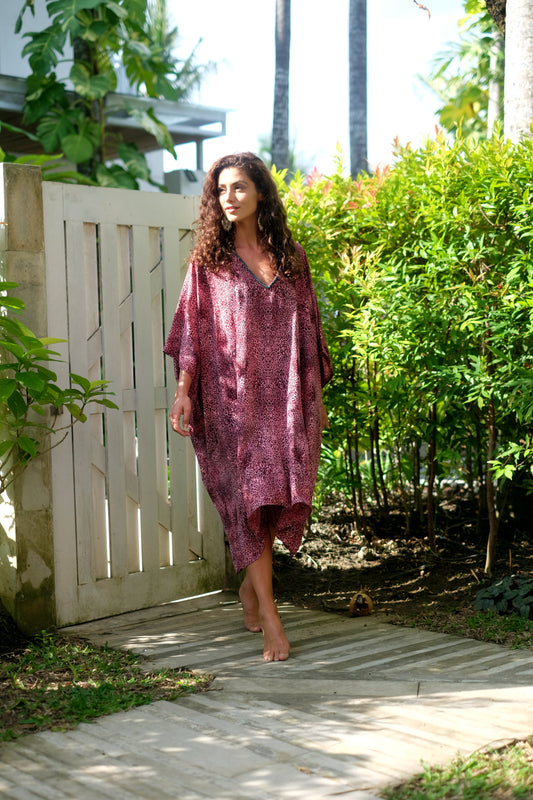 Eco-friendly leopard print women's beach kaftan with hand-sewn beads, perfect for Dubai beach days and city outings.