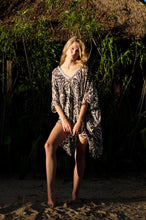 Load image into Gallery viewer, Sheer zebra print silk kaftan top, luxurious resort wear for women for Dubai’s vibrant resort lifestyle.
