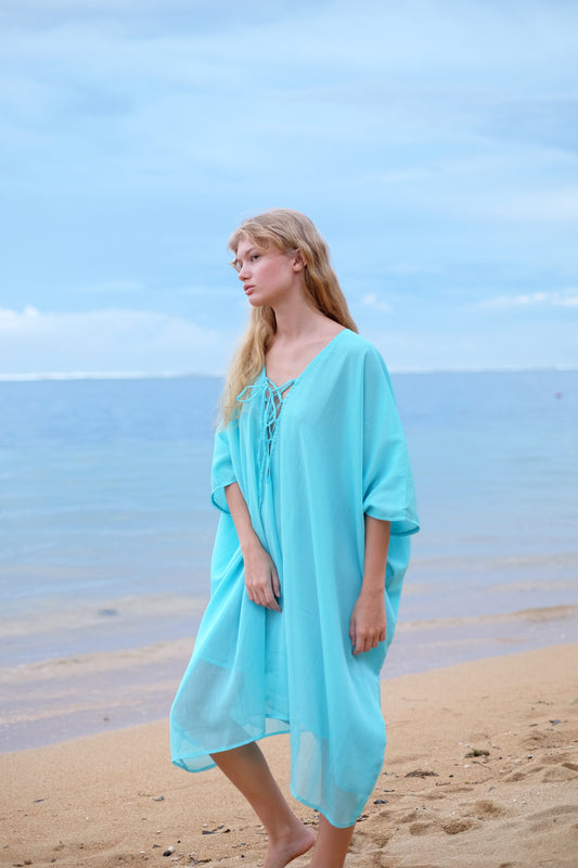 Versatile Seraphina Aquamarine Kaftan Dress, ideal for beach vacations or beach clubs and seaside adventures in Dubai. Sustainable beachwear brand in Dubai.
