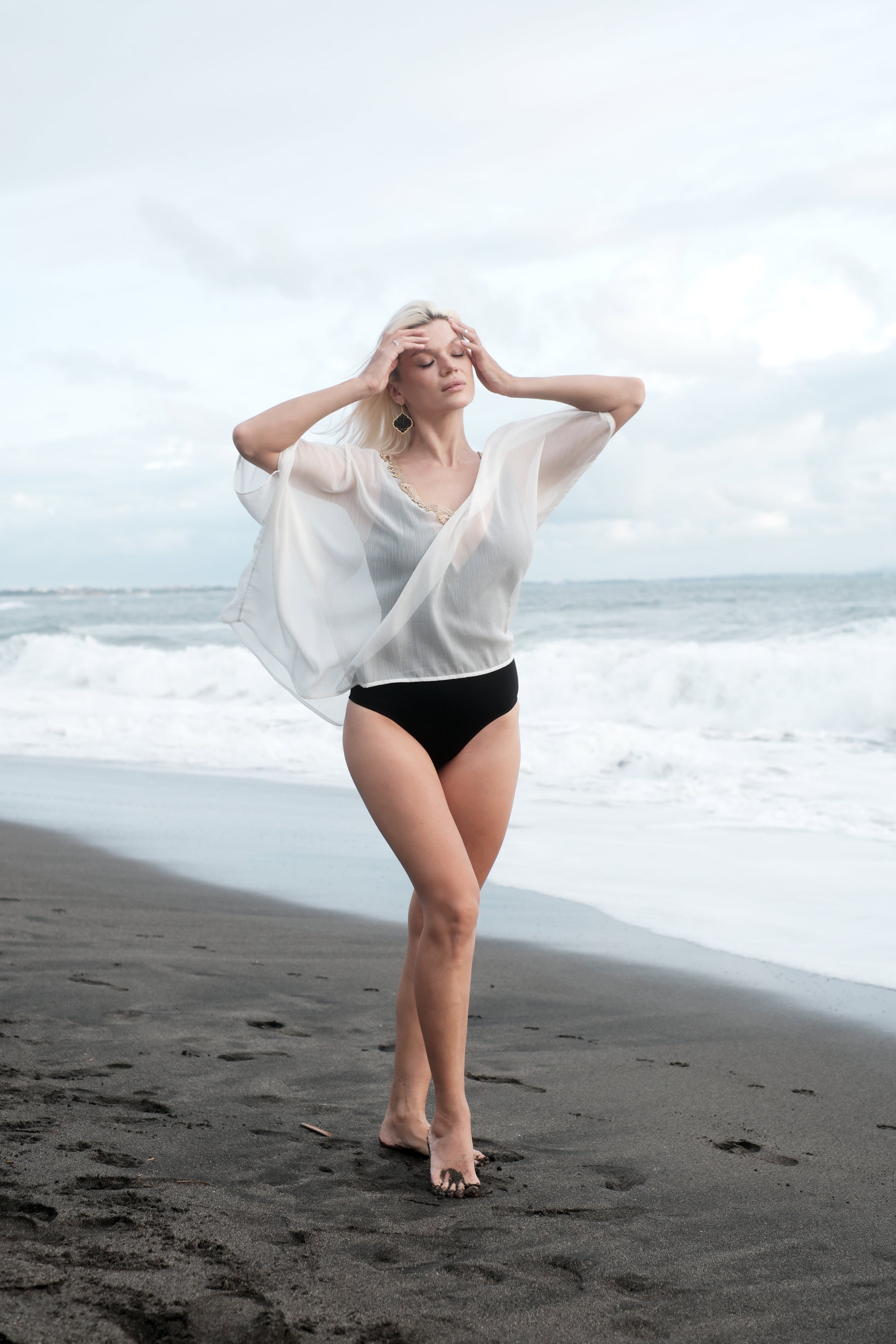 White beach kaftan with gold trim for women, sustainably made resort-style beach cover-up ideal for Dubai holidays.
