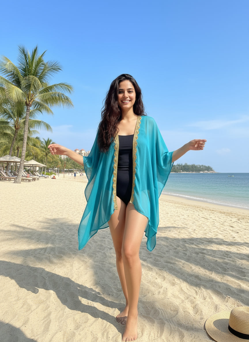 Flowing turquoise and gold beach kaftan for women, artisan-nade and sustainable beachwear from Bali.