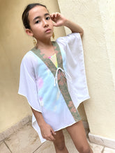 Load image into Gallery viewer, Onism white lurex chiffon beach kaftan for kids, featuring vibrant sage and pink Indonesian batik trim for a stylish beach look
