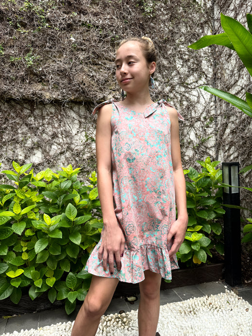 Handmade Penelope girls’ batik sundress in blush pink floral print, ethically & sustainably made in Bali, for sale in Dubai
