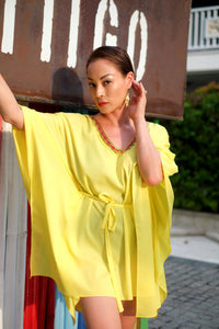 Dubai beach kaftans for women in yellow with indian inspired neckline trim and belt for cinched waist, perfect for dubai holidays