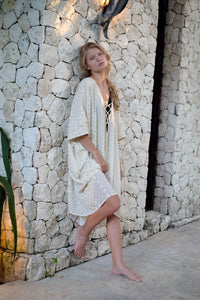 Versatile cream and gold Seraphina kaftan dress featuring delicate gold motifs, perfect for beach resorts and evening wear in Dubai.