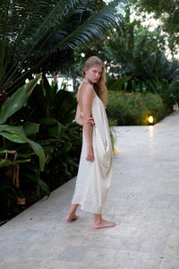 Back view of stylish and chic Seraphina kaftan dress in cream and gold, offering three different ways to wear, ideal for glamorous beach holidays.