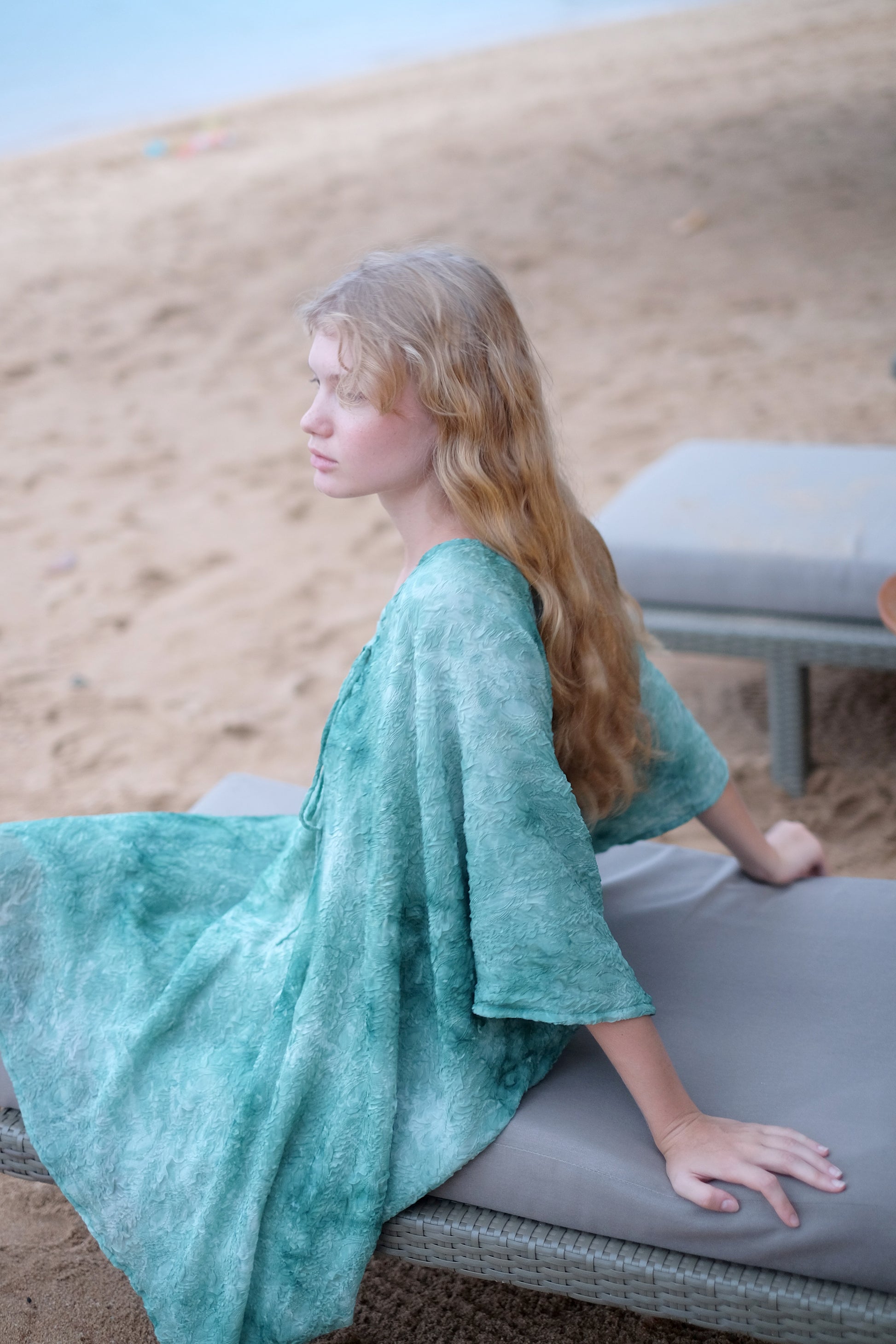 Seraphina kaftan dress in textured green chiffon, ideal for resort holidays, Dubai beaches, or elegant outings. Sustainable resort wear for women made in Bali for fashionable ladies in Dubai