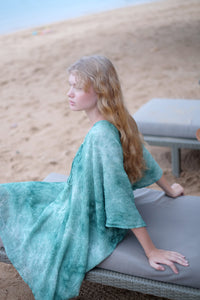 Seraphina kaftan dress in textured green chiffon, ideal for resort holidays, Dubai beaches, or elegant outings. Sustainable resort wear for women made in Bali for fashionable ladies in Dubai