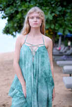 Load image into Gallery viewer, Chic textured green chiffon Seraphina kaftan dress styled as a halter, blending versatility with glamour for fashionistas in Dubai who love sustainable fashion.