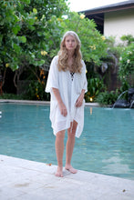 Load image into Gallery viewer, Lightweight and breezy white Seraphina kaftan dress with metallic details, perfect for Dubai beach days, sustainable resort wear for women made in Bali
