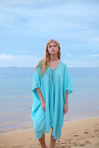 Seraphina Kaftan Dress in aqua blue chiffon, showcasing bold style and versatile styling options for resort holidays and beach escapes in Dubai and beyond.