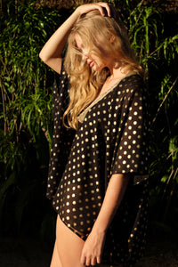 Shop Seema Black Kaftan with Indian-inspired gold motif and hand-sewn trim, eco-friendly Bali-made resort wear in Dubai.
