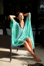 Load image into Gallery viewer, Elegant luxury V-neck beach kaftan in green snake print, flowy and stylish beach cover up for women looking for best beach kaftans in Dubai

