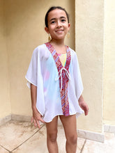 Load image into Gallery viewer, Flowing and comfortable Onism Kids Beach Kaftan with breathable white lurex chiffon and handmade purple and burnt orange batik trim, for sale in dubai
