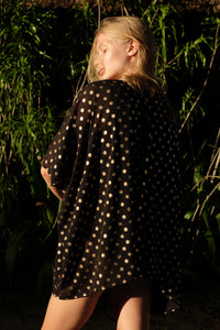 Elegant Seema V-neck black kaftan with gold motif print, Bali-made sustainable resort wear for Dubai.
