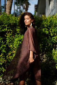 Back view of Tamala sheer leopard print resort wear beach kaftan with v-neckline and luxe detailing, perfect for Dubai fashion and holidays

