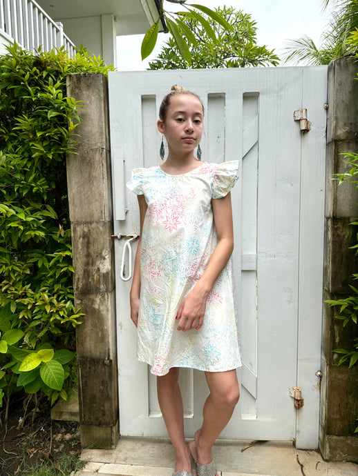 Sustainable Tallulah girls’ batik sundress in white with ruffle sleeves, handmade kids' dress from Bali for sale in Dubai
