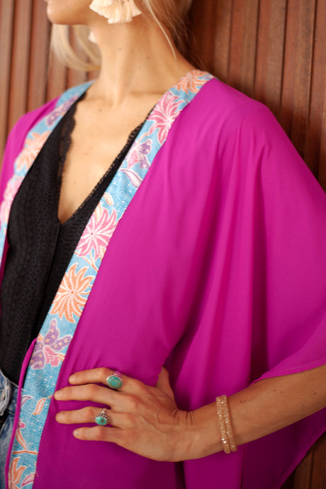 Orchid purple Utama beach kaftan with Indonesian batik trim – lightweight chiffon resort wear for Dubai.
