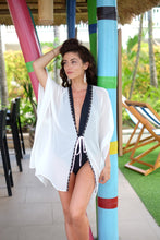 Load image into Gallery viewer, Modern white textured beach kaftan with handsewn black &amp; silver beads along the neckline, with handmade earrings, designed in Dubai, handmade in Bali