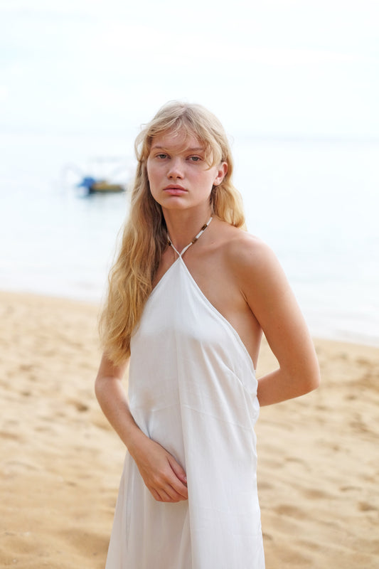 White halter midi beach dress with tiger’s eye beads handmade in Bali for Dubai resorts and holidays