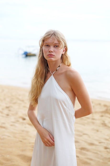 White halter midi beach dress with tiger’s eye beads handmade in Bali for Dubai resorts and holidays