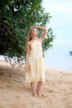 Load image into Gallery viewer, Flowy Mimi yellow floral midi dress ideal for beach vacations or casual beach days and other outings in Dubai.