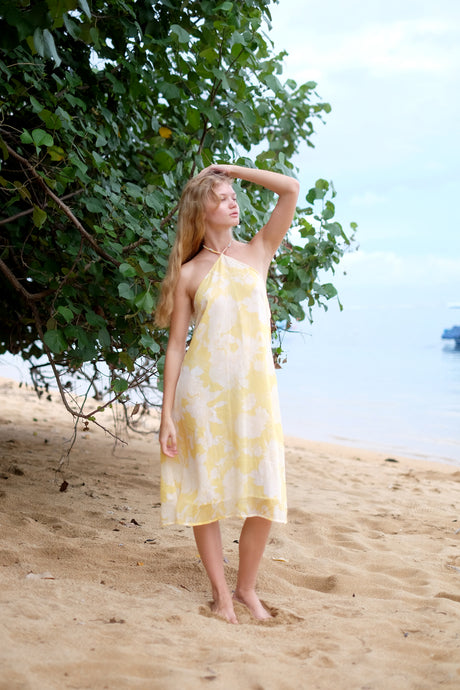 Flowy Mimi yellow floral midi dress ideal for beach vacations or casual beach days and other outings in Dubai.