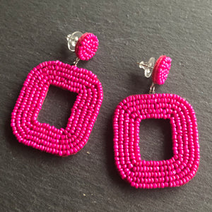 Yelia handmade beaded bold coloured statement dangle earrings in fuchsia